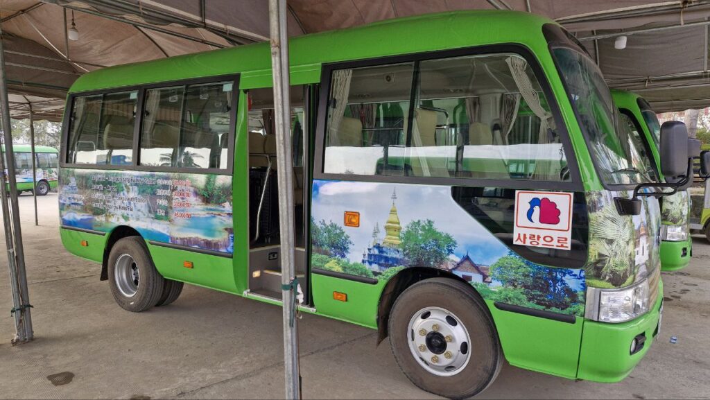 green bus from luang prabang to kuang si waterfall