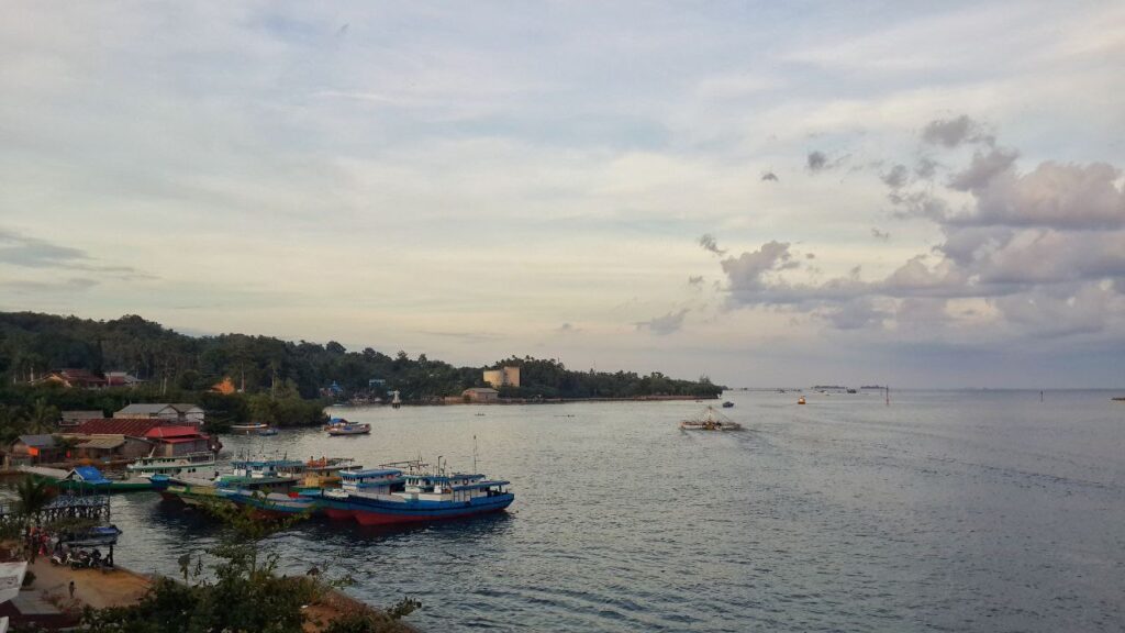 Afternoon panorama of Kendari Bay showing fishing boats and calm waters