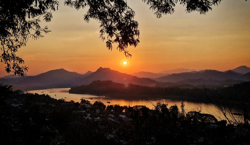 sunset golden hour view from Mount Phousi overlooking mekong river