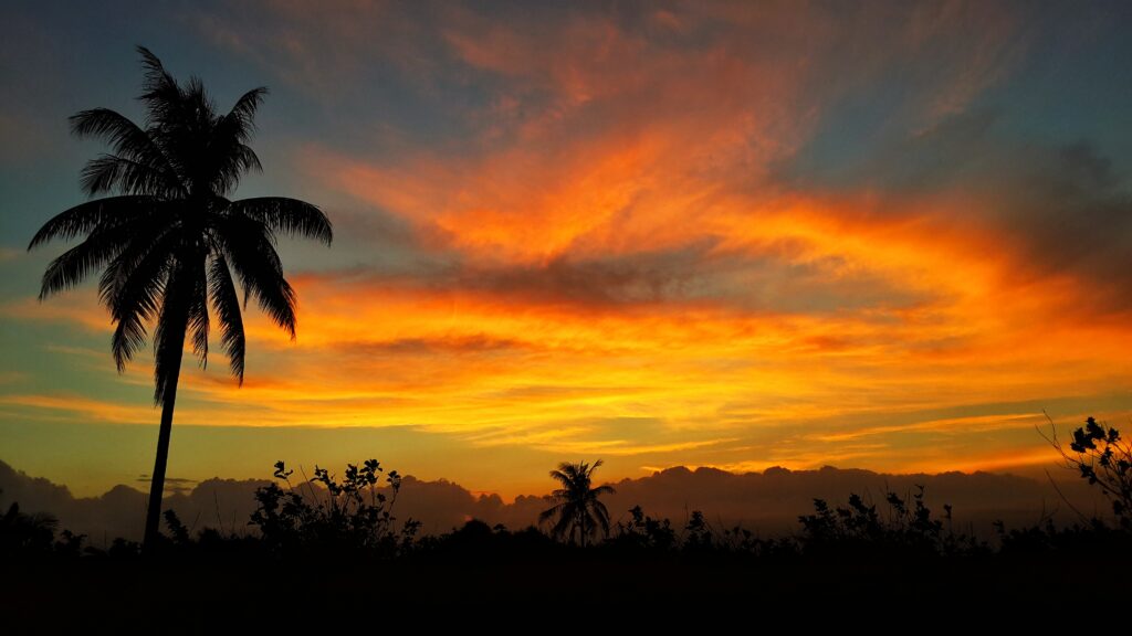 golden sunset in Natuna Indonesia with island silhouettes
